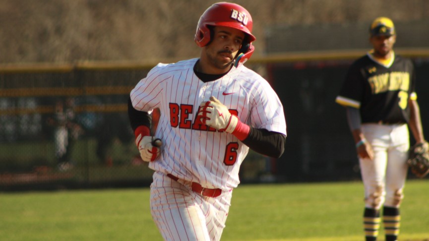 Action picture of BSU left fielder Jamie Luna